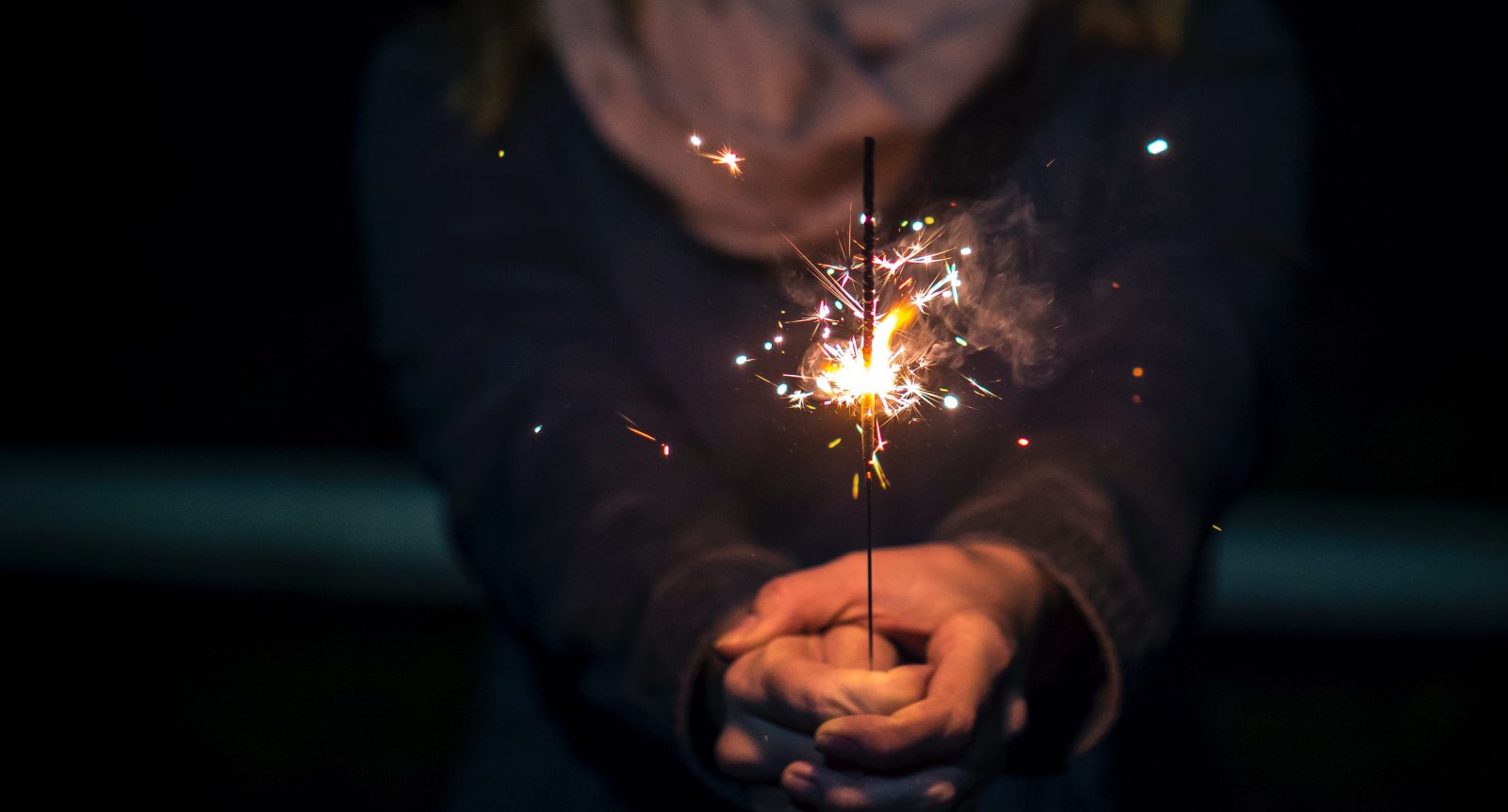 A sparkler held in a person's hands